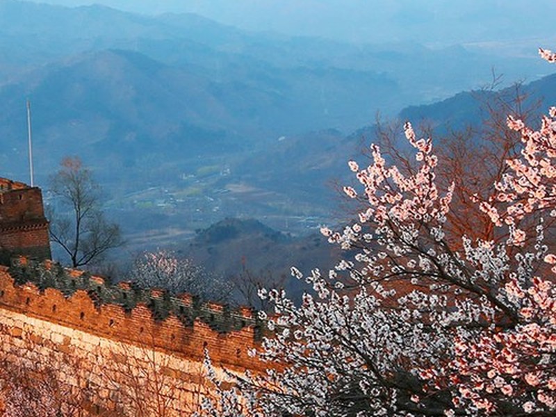 The Mutianyu Great Wall winding across forested ridges near Beijing